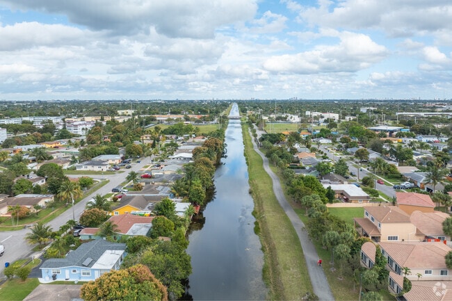 Immerse yourself in the serene beauty of canal-side living in Lauderdale Lakes.