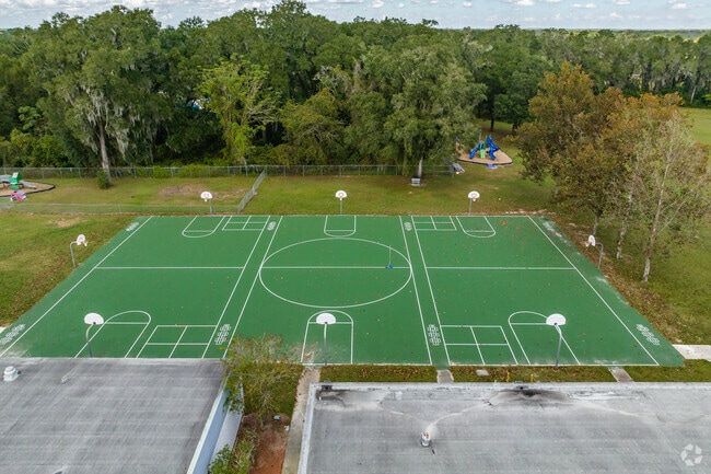Kids enjoy outdoor play on the sports courts at Lacoochee Elementary school.