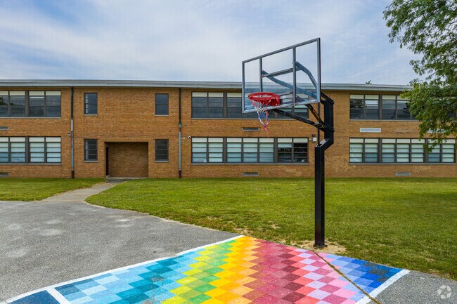 Students can play basketball outside during recess at Anna P. Mote Elementary in Wilmington.