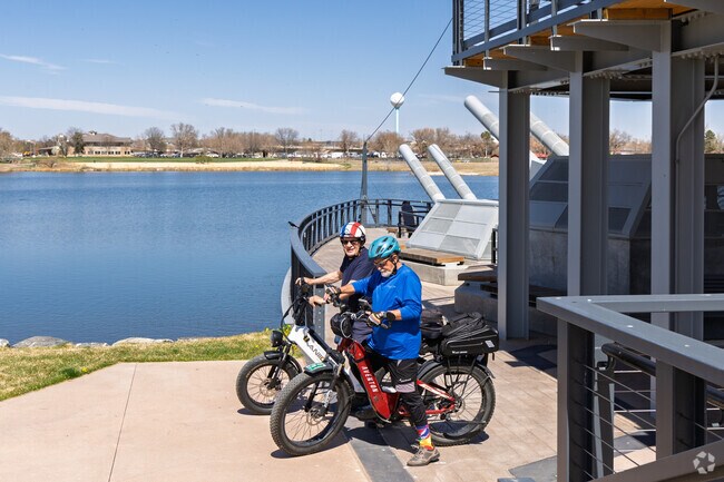 The Villages at Riverdale locals ride bikes with friends around the Riverdale Regional Park.