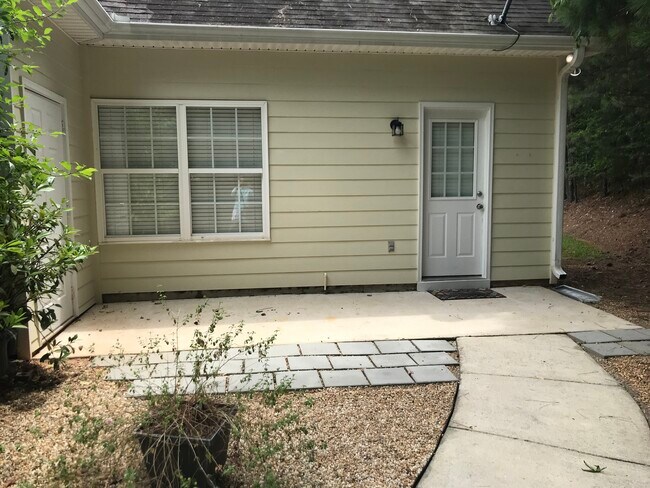 Back patio has access to unit dedicated parking area, outside storage room and a large patio great for grilling!