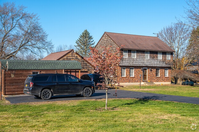 Homes in Somerset often feature steaply pitched roofs and garages.