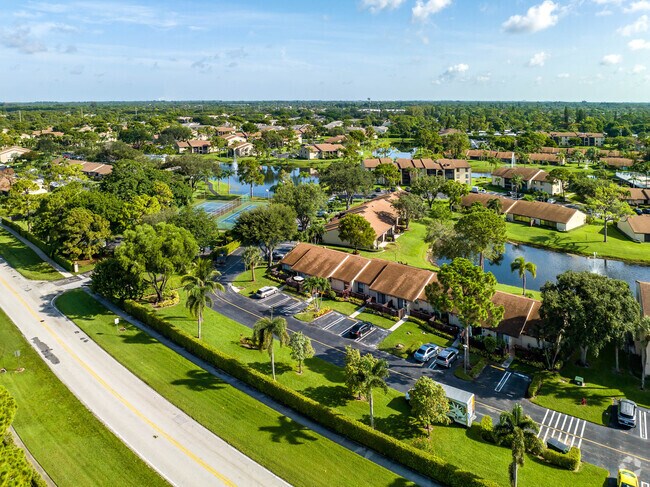 The Ashley subdivision is characterized by lush greenery and clear blue bodies of water.