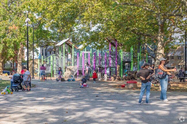 Kids of Dickinson Square West can tire out on the large jungle gym at Gold Star Park.