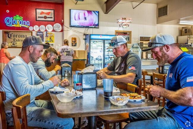 A working crew enjoys all-you-can-eat lunch at Biggs’ Pizza Round-Up.
