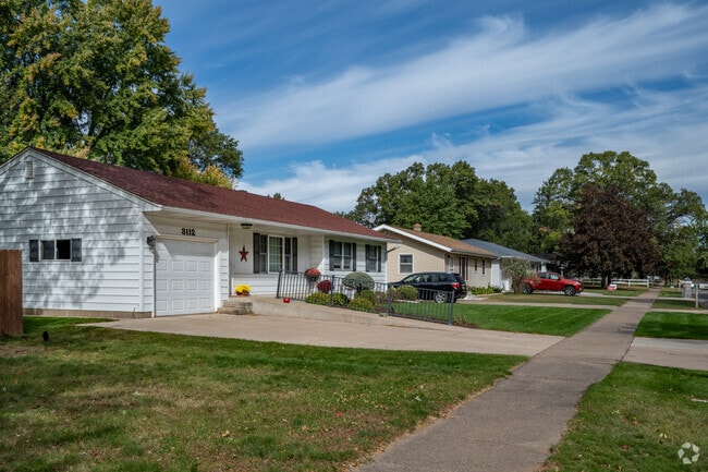 Rows of ranch-style homes in the Airport neighborhood sit on sidewalk-lined streets.
