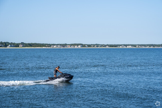 A jet ski heads out of the Bay to the open ocean in Osterville.