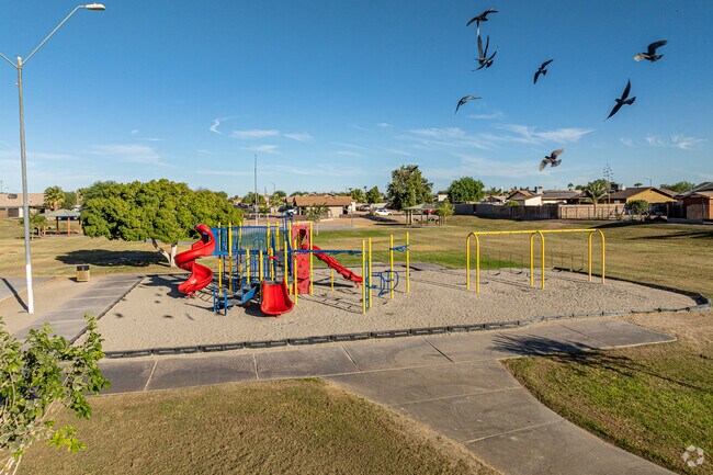 Some visitors enjoy feeding and watching the pigeons at Joe Cabello Park in San Luis, Arizona.