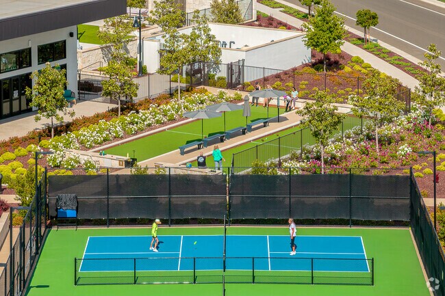 The clubhouse in this luxury home complex in Folsom Ranch has a pool, tennis courts and bocci ball courts.