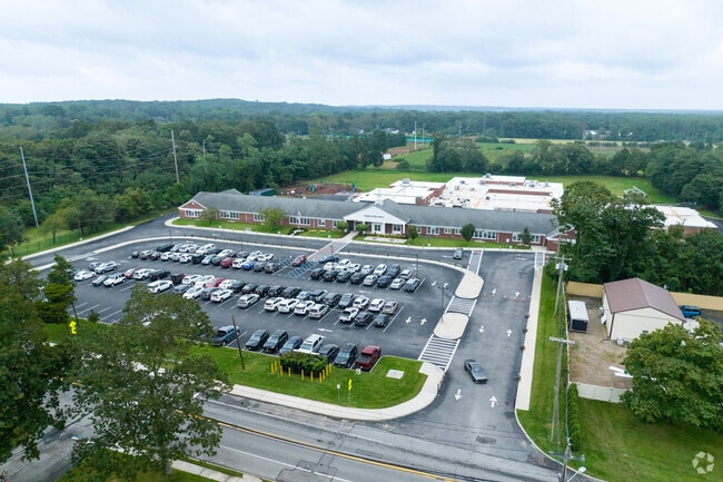 NID 537930 Wading River School is located right off Route 25a near a commercial district.