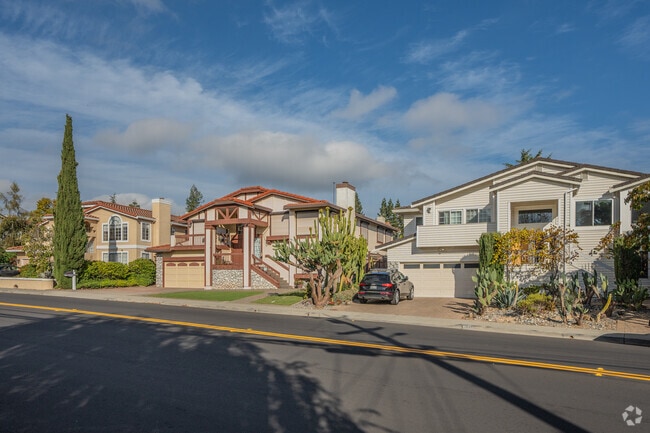Rows of large homes along a hilly street in Alder Manor are common in this neighborhood.