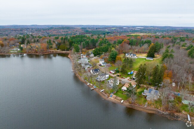 Many homes surround Sugden Reservoir within Spencer.