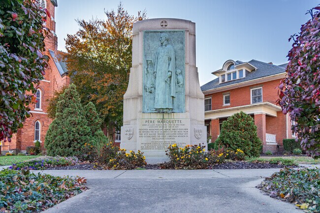 The Père Marquette monument in North Utica honors the French missionary and explorer who helped shape Illinois history, standing as a tribute to the region’s rich cultural heritage.