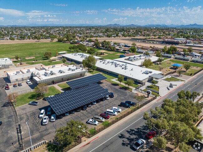 Solar panels offer shade to the parking lot as well as electricity at Heatherbrae School.