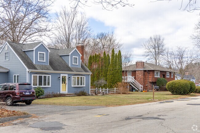 A row of homes including a Cape Cod styled home in the West End neighborhood.