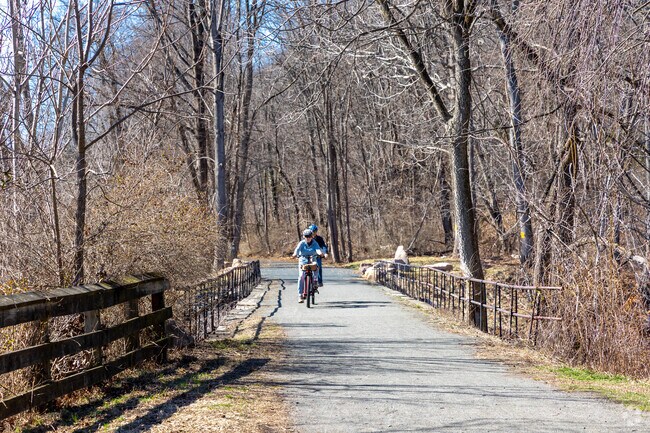 D&R Canal State Park stretches 77 miles through NJ, featuring scenic trails for hiking, biking, and boating.
