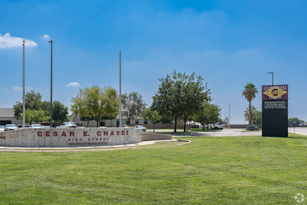 A concrete sign and marquee at the entrance to Cesar E. Chavez High School.