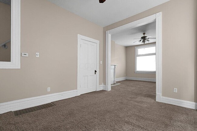 Dining room with living room in background