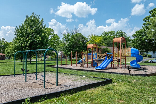 Swing high into the sky or slide down to the ground at College Hill Park.