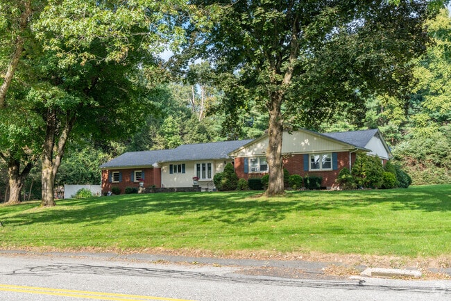 East Hampton is full of Ranch style homes nestled among lush foliage.