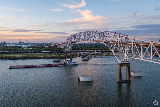 A colorful sunset over Gulfgate Bridge exiting Port Arthur.