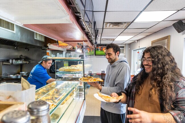 Locals step into King's Pizzarama for the warm atmosphere and mouthwatering pizza, near Braeburn Heights.