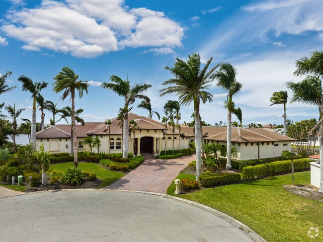 Towering royal palms overlook this McGregor home.