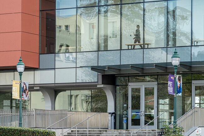 A student walking through a campus building at Whittier College, Whittier