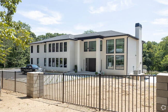 Original homes are being torn down in Dix Hills and new modern farmhouses are being built.