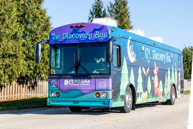 Literacy comes on wheels in River Crossing with the Public Library Bus.