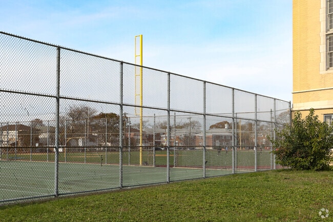 Behind the AMT building is a field and tennis courts in Far Rockaway, NY. -