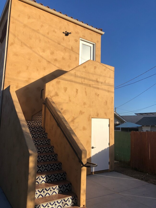 Rear entrance and door to first-floor storage.