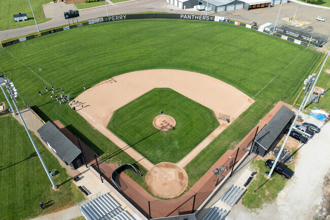 The Perry High School Panthers baseball team warms up for a game in Reedurban.