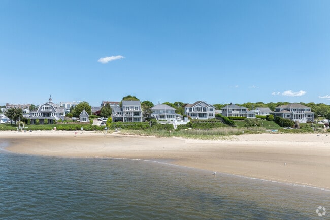 The sandy beaches of Hyannis are only a few steps from the back door of these Hyannis Homes.