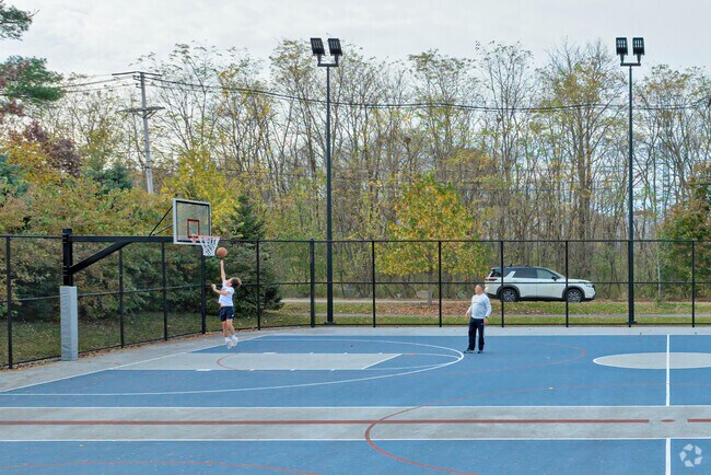 A kid shoots their shot on a basket at Yentile Farm Recreational Facility in Wilmington.
