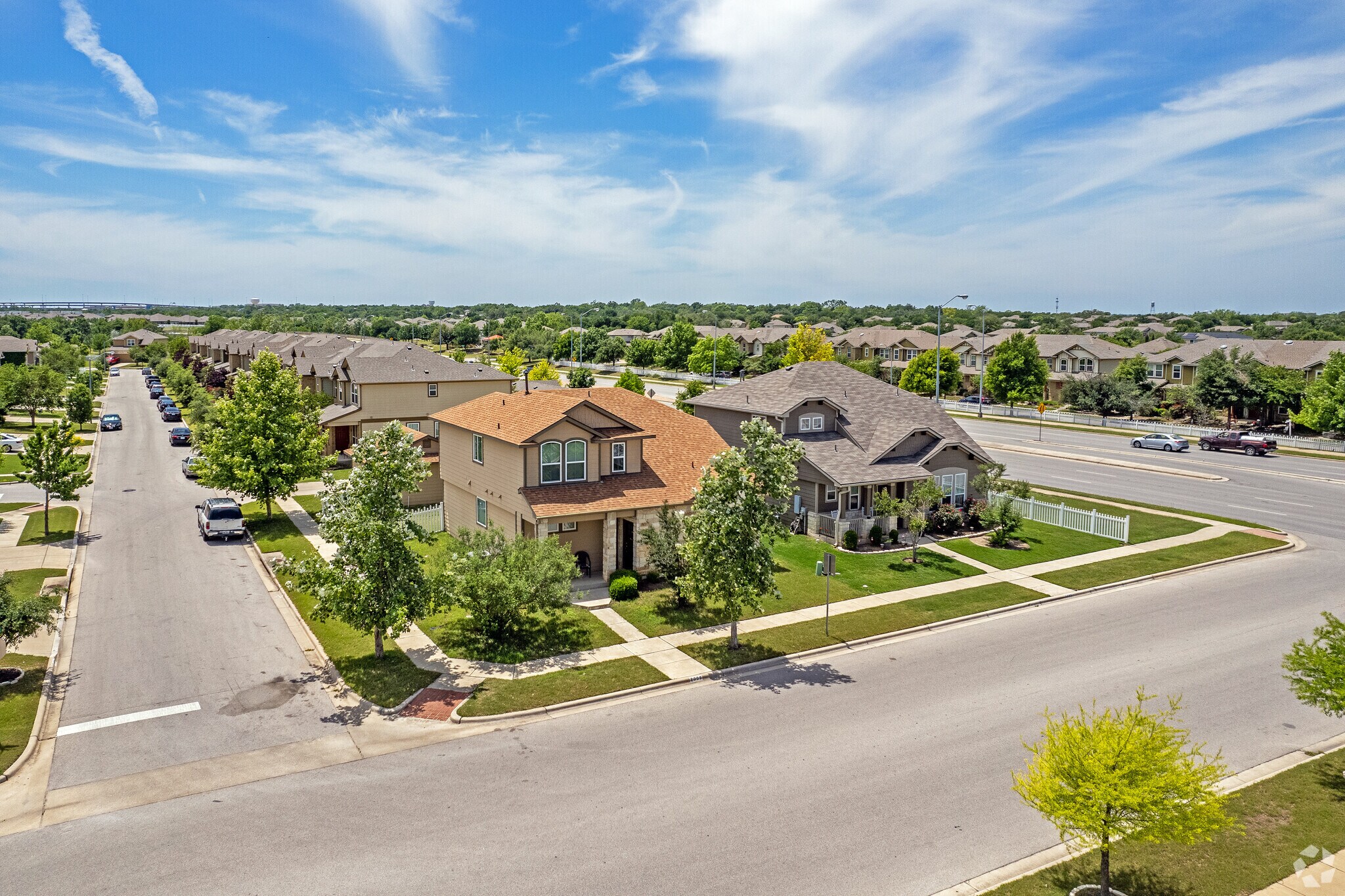 Homes have gridded-style lots with garages in the back throughout Gattis School.