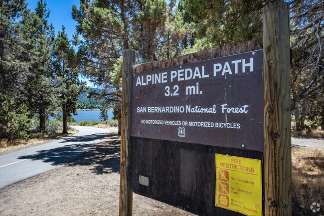 Alpine Pedal Path in the San Bernardino National Forest offers a 3.2-mile non-motorized trail with scenic lake views.