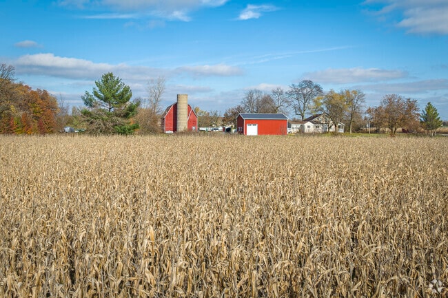 Lake Dalecarlia is a place that is surrounded by several farmhouses and barns.