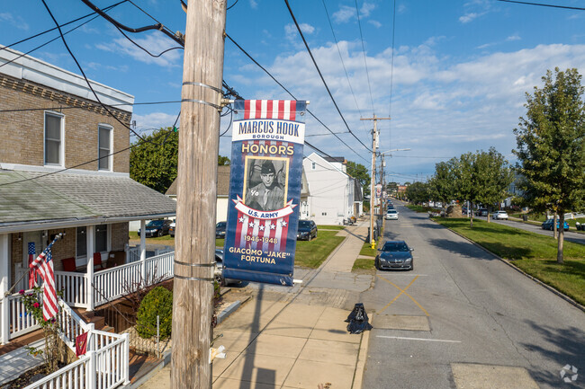 Marcus Hook residents proudly display photos of family members who served in the military.