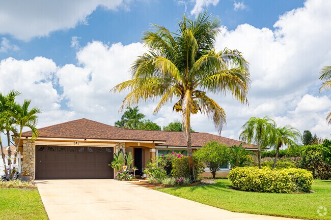 Single-family ranch style homes with tropical landscaping are popular in Hibiscus Country Club.