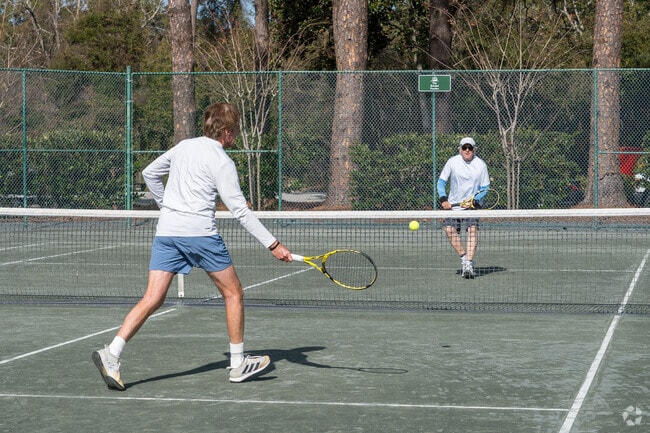 The neighborhood features amenities like tennis courts and golf courses.
