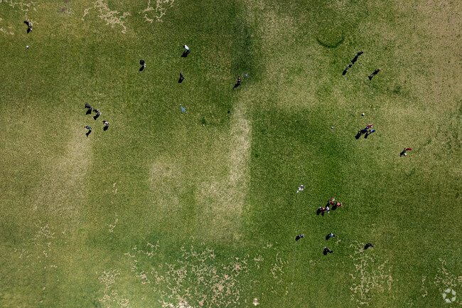 Ecker Hill Middle School students play on a multi-use sports field.