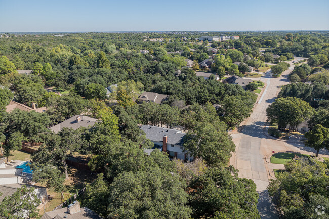 In Huntwick, residents appreciate the large homes set amid dense, ancient trees.