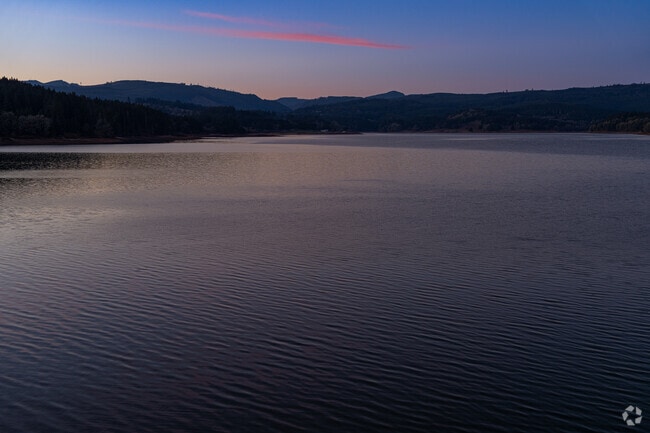 A glimpse of the last light reflecting on Hagg Lake, a popular place for recreation in the summer.