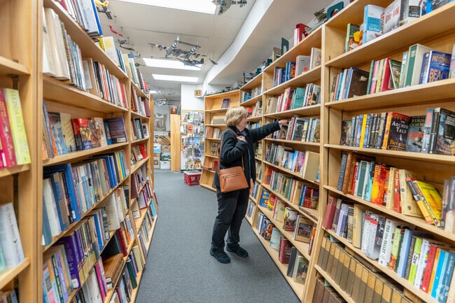 A woman searches for books at the independent bookstore Toadstool near Greenfield.