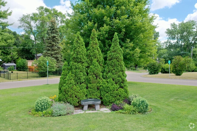A small memorial bench sits in front of Good Shepherd School.