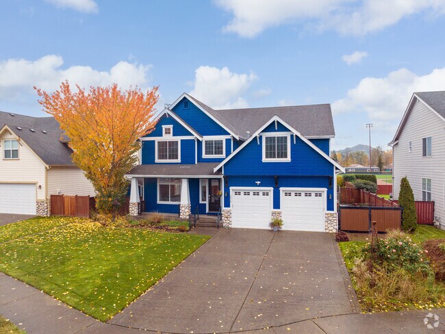 A beautiful split-level home with white two car garage in Enumclaw.