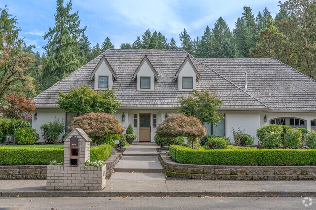 A modern Cape Cod home in Blue Heron exemplifies luxury design, spacious interiors, and prime location near Oswego Lake’s tranquil canals.