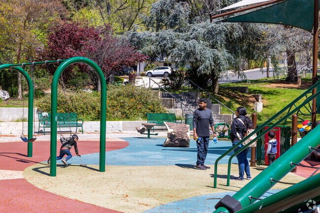 Porter Ridge Park features a scenic playground nestled in lush greenery.