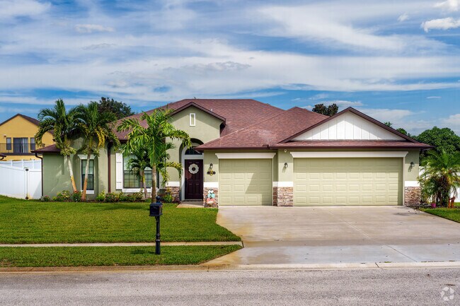 The Mims community features homes in charming colors with brick accents.